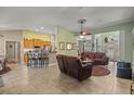 Open living room and kitchen layout with tile floors at 3967 Se 99Th St, Belleview, FL 34420