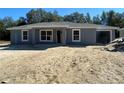 Newly constructed home with gray siding at 1339 Nw 53Rd Ave, Ocala, FL 34482