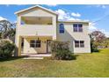 Two story home with front porch and well-maintained lawn at 10 Se Chinica Drive, Summerfield, FL 34491