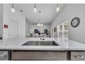 Kitchen sink and island with white countertops at 1789 Usrey Ct, The Villages, FL 34762
