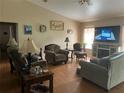 Spacious living room with hardwood floors and fireplace at 6690 Cherry Rd, Ocala, FL 34472