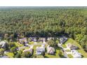 Aerial view of a residential community nestled in a lush forest setting at 11696 Sw 71St Cir, Ocala, FL 34476