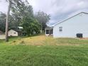 View of the back of the house and a large backyard at 11591 Sw 78Th Ave, Ocala, FL 34476