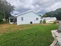 Another view of the back of the house and the backyard at 11591 Sw 78Th Ave, Ocala, FL 34476