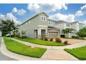Two-story house showcasing a brick facade and landscaping at 7694 Graben St, Kissimmee, FL 34747