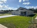 Newly built home with three-car garage and stone accents at 7160 Sw 179Th Court Rd, Dunnellon, FL 34432