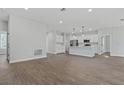 Modern kitchen with white cabinets and an island at 3395 Sw 133Rd Lane Sw Rd, Ocala, FL 34473