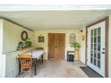 Covered patio with table and chairs, great for outdoor dining at 12369 Se 130Th Ct, Ocklawaha, FL 32179