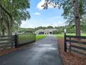 Private gated entrance leading to a charming house at 1620 Nw 73Rd Ter, Ocala, FL 34482