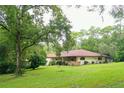 Ranch-style home nestled on a large lot at 21389 Sw 102Nd Street Rd, Dunnellon, FL 34431