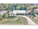 Aerial view of a charming ranch home with a large yard at 6340 Se 127Th Pl, Belleview, FL 34420