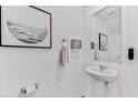 Small powder room with pedestal sink and mirror at 6595 Sw 81St Loop, Ocala, FL 34476