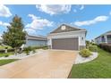 House exterior with landscaping and a driveway at 9911 Sw 100Th Terrace Rd, Ocala, FL 34481