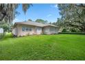 Spacious backyard with lush green grass at 11196 Ne 227Th Place Rd, Fort Mc Coy, FL 32134