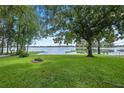 Lake view from backyard with large oak trees at 11196 Ne 227Th Place Rd, Fort Mc Coy, FL 32134
