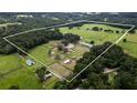 Farm with various buildings and pastures at 8010 Nw 125Th St, Ocala, FL 34482