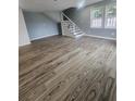 Spacious living room featuring wood-look floors and neutral walls at 1510 Nw 48Th St, Ocala, FL 34475