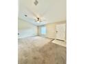 Bright and airy living room featuring carpeted floors and a ceiling fan at 16331 Sw 37Th Terrace Rd, Ocala, FL 34473