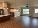 Open living room with hardwood floors and high ceilings at 15443 Sw 23Rd Ct, Ocala, FL 34473