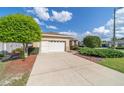 One-story home with a two-car garage and nicely landscaped yard at 9053 Sw 103Rd Ave, Ocala, FL 34481