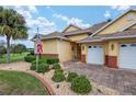 House exterior with landscaping and driveway at 8463 Sw 84Th Loop, Ocala, FL 34481