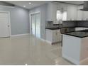 Modern kitchen with large island and stainless steel appliances at 8028 Se 62Nd Ln, Ocala, FL 34472