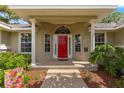 Inviting front porch with red door and white columns at 2215 Se 24Th Ave, Ocala, FL 34471