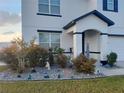 Landscaped front yard with decorative rock and well-maintained shrubs at 4551 Ne 27Th St, Ocala, FL 34470