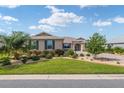 Two-story house with a landscaped lawn and paver driveway at 8445 Sw 93Rd Cir, Ocala, FL 34481