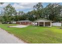 Brick home with carport and fenced backyard at 5456 Nw 64Th St, Ocala, FL 34482