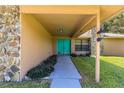 Inviting entryway with teal doors and stone accents at 4980 Sw 195Th Ave, Dunnellon, FL 34431