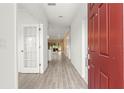 Bright entry hall with tile flooring and views into the living areas at 7867 Sw 74Th Loop, Ocala, FL 34481