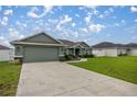 One-story house with green exterior and a spacious lawn at 4978 Sw 91St St, Ocala, FL 34476