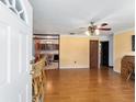 Bright living room with hardwood floors and view into kitchen at 1856 Ne 22Nd St, Ocala, FL 34470