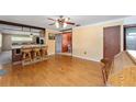 Open dining area with hardwood floors and breakfast bar at 1856 Ne 22Nd St, Ocala, FL 34470