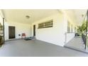 Covered front porch with access to the front door at 1856 Ne 22Nd St, Ocala, FL 34470
