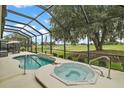 Relaxing pool and hot tub area with golf course views at 3211 Killington Loop, The Villages, FL 32163