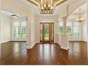 Grand entryway with hardwood floors, high ceilings, and a chandelier at 8280 Se 15Th Ct, Ocala, FL 34480