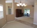 Dining room with hardwood floors and access to screened porch at 11890 Sw 137Th Loop, Dunnellon, FL 34432