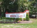 Hidden Lake community entrance sign with landscaping at 7658 Sw 102Nd Loop, Ocala, FL 34476