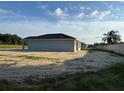 Newly built gray house with a large backyard at 10816 Se 66Th Ave, Belleview, FL 34420