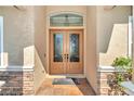 Elegant double front doors with iron accents at 6925 Se 96Th Place Rd, Belleview, FL 34420
