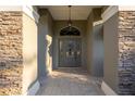 Inviting front entrance with stone accents and a charming glass-paneled door at 6251 Se 8Th Ln, Ocala, FL 34472