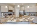 Modern kitchen with granite countertops and stainless steel appliances at 4737 Nw 39Th Street Rd, Ocala, FL 34482