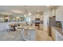 Open concept kitchen with granite island and stainless steel appliances at 4743 Nw 39Th Street Rd, Ocala, FL 34482