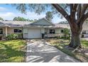 House exterior showcasing front yard and driveway at 9755 Sw 94Th Ter # C, Ocala, FL 34481