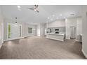 Spacious living room with high ceilings and vinyl flooring at 7570 Sw 100Th St, Ocala, FL 34476