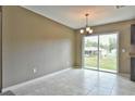 Simple dining room with sliding glass doors leading to the backyard at 12321 Se 102Nd Ter, Belleview, FL 34420