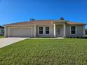 One-story home with attached garage and landscaped lawn at 14984 Sw 28Th Terrace Rd, Ocala, FL 34473