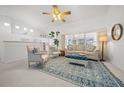 Bright living room with comfy seating and a large window at 4762 Nw 30Th Pl, Ocala, FL 34482